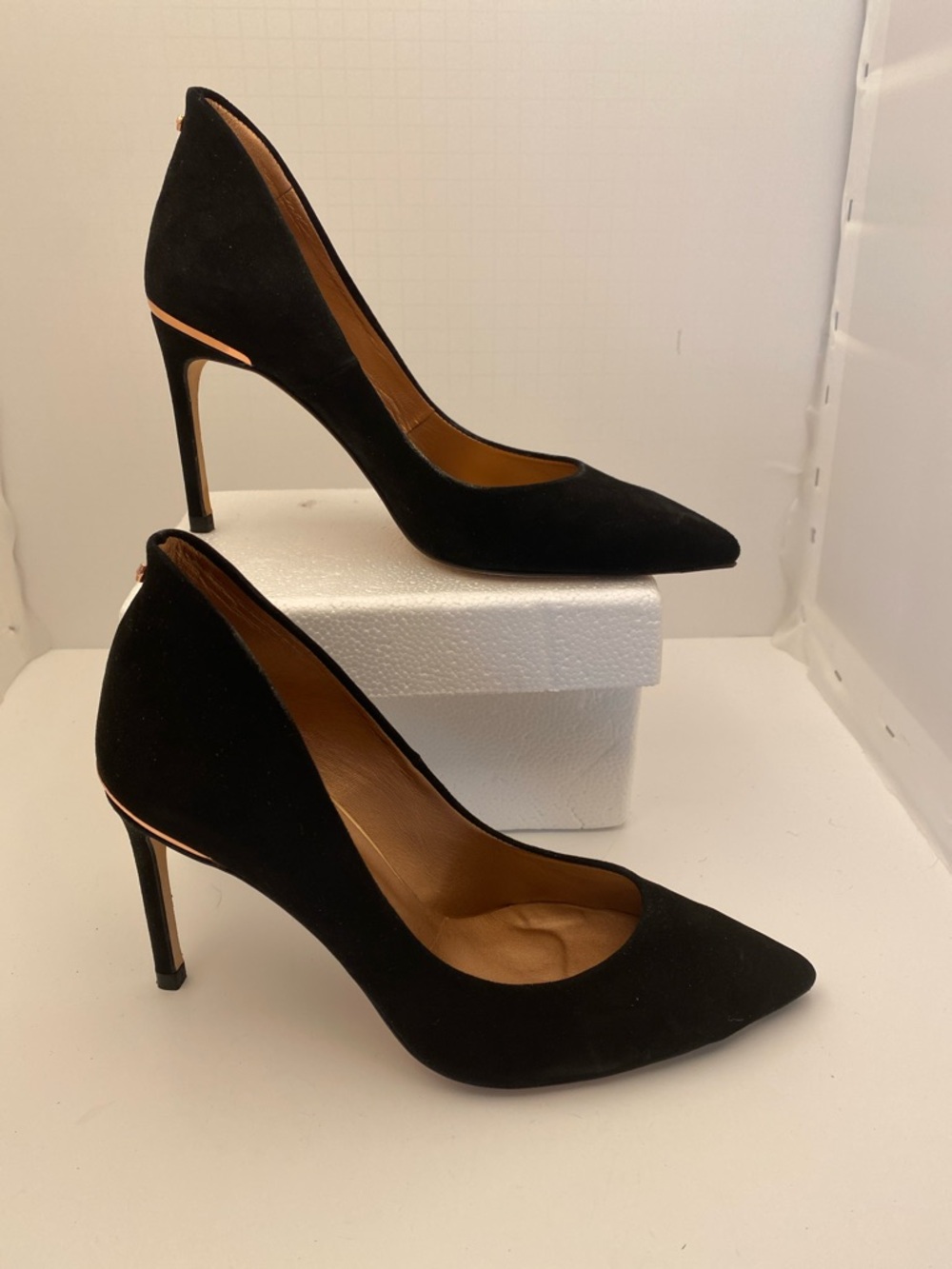 Ted Baker London Black Pointed-Toe Suede Pumps with Rose Gold Accent